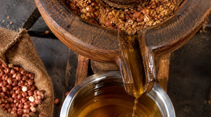raditional wooden ghani extraction method for the best cold pressed oil for cooking in india